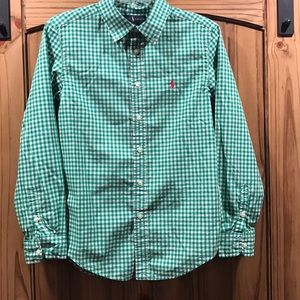 Green in checkered polo shirt